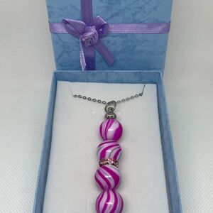 Exquisite Pink & White Swirl Necklace
Expertly Handcrafted, Exclusively Yours
